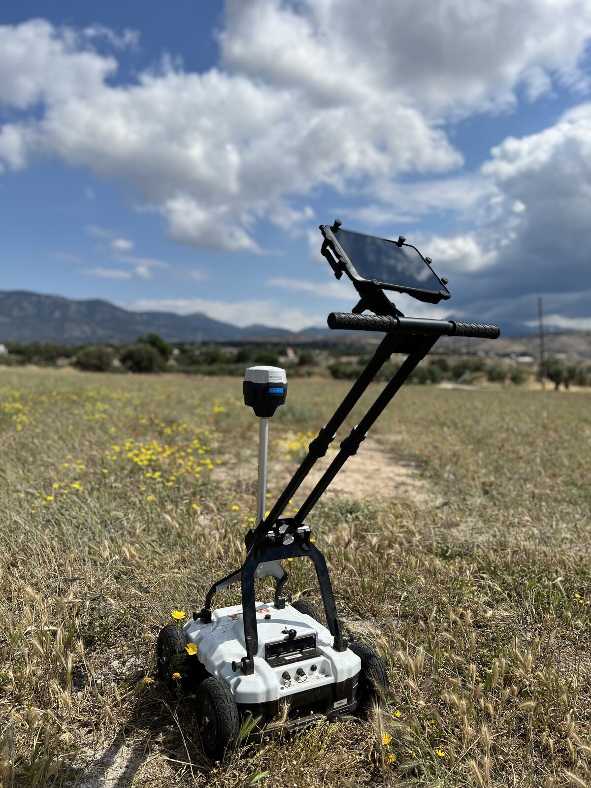 Geomorph Imaging GPS-tracked GPR survey cart deployed in an open field survey, Greece